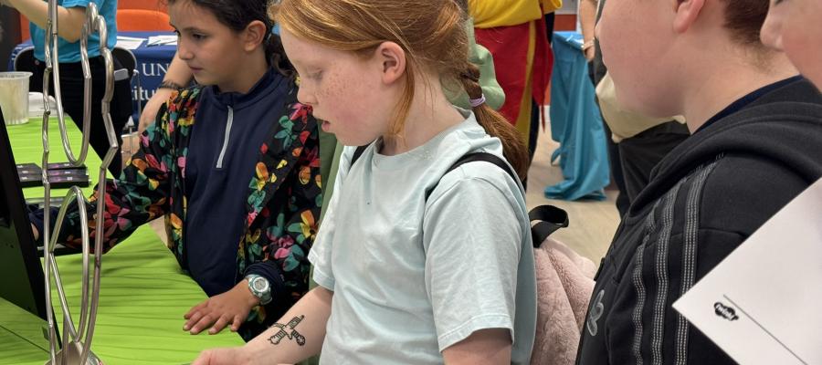 Children playing circuit buzzer game at Doors Open Day event