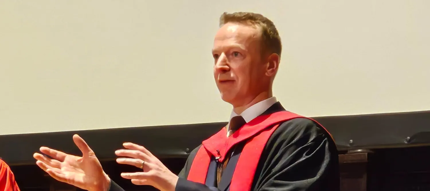 Prof Baillie presenting in his gown