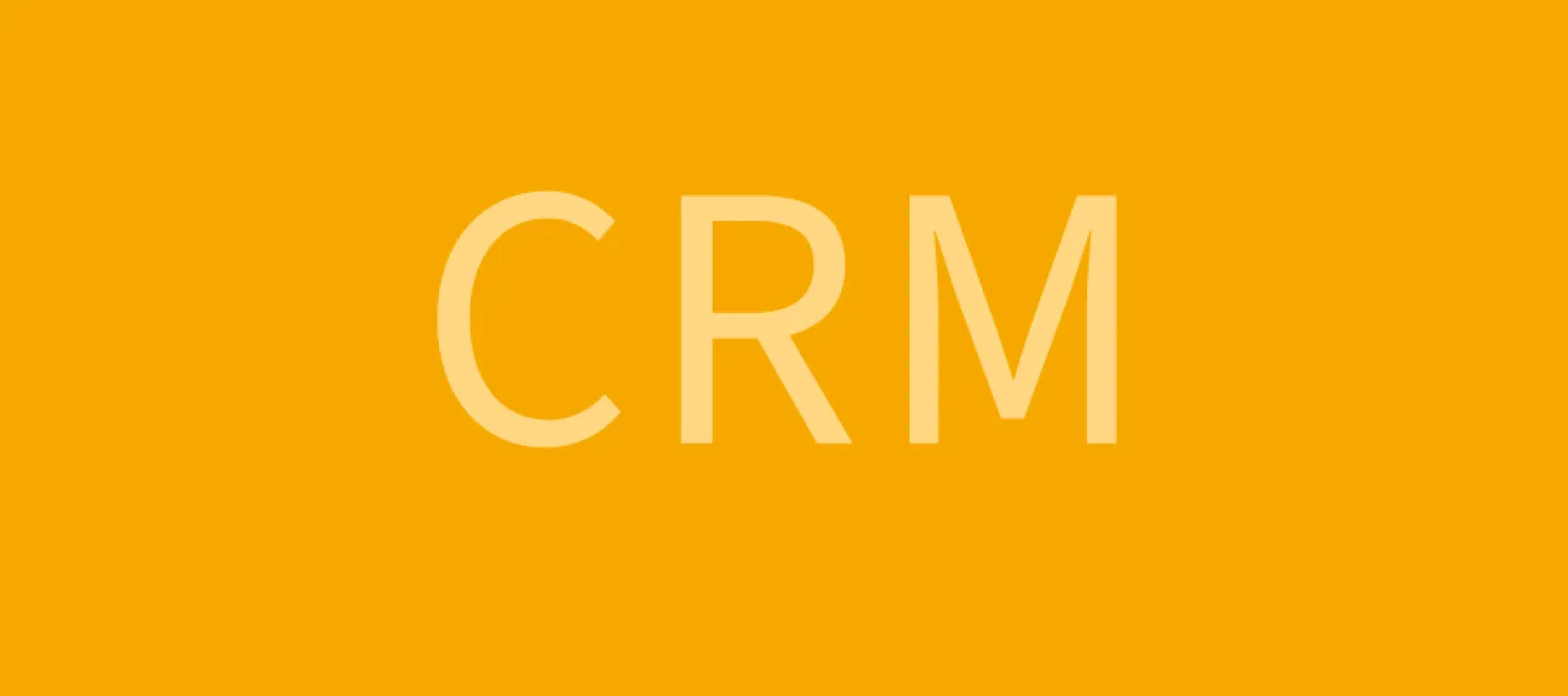The letters CRM on a yellow background