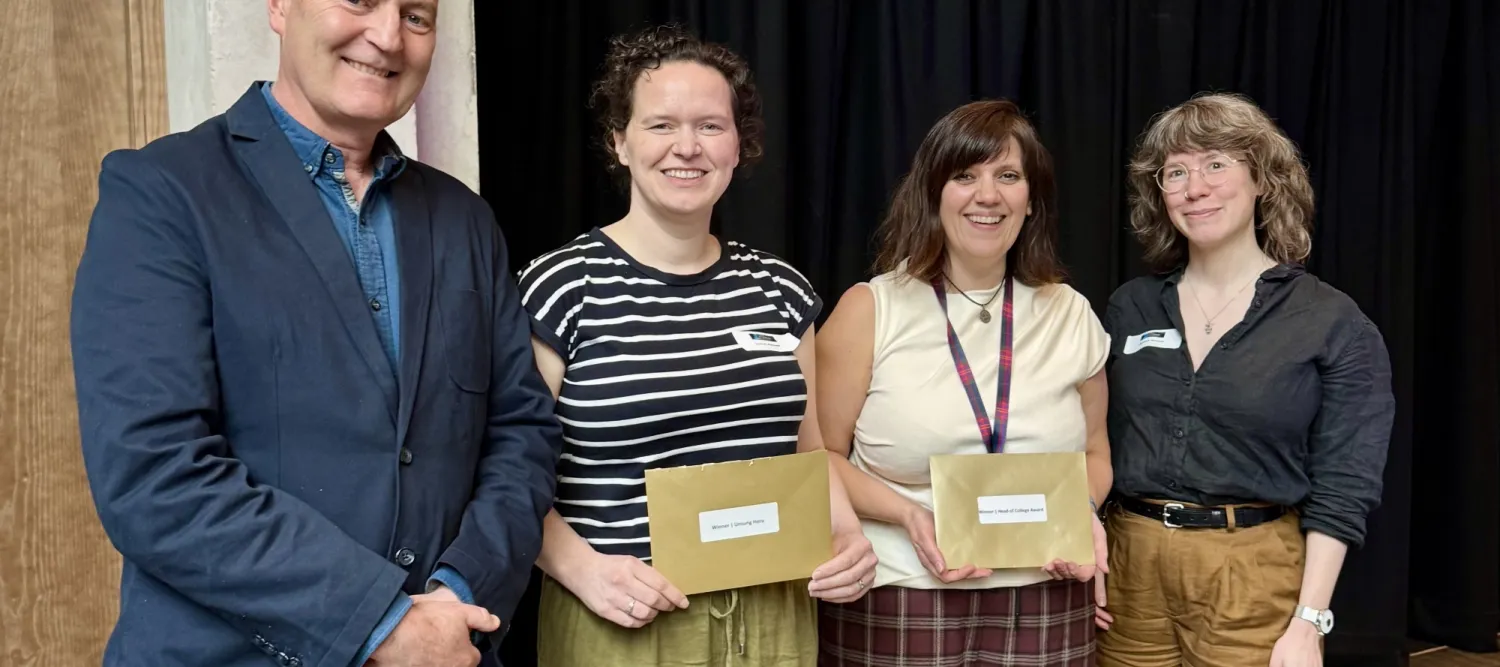 Stuart Forbes, Lauren Melrose, Shonna Johnston, and Florence Gohard standing in a line in front of a black curtain