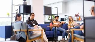 students in a lounge area chatting