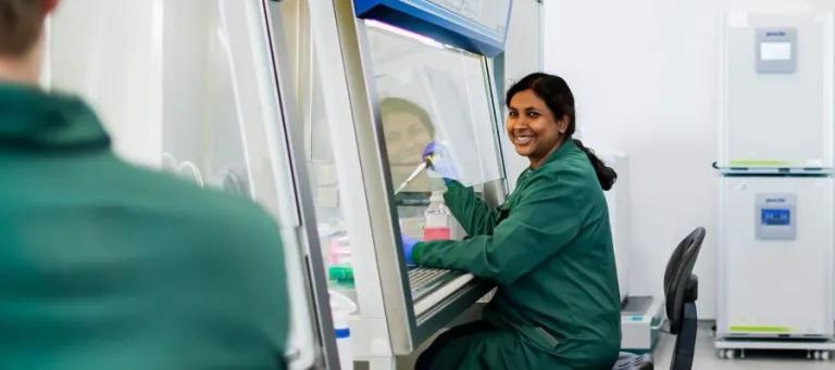 Scientist doing cell culture in a lab