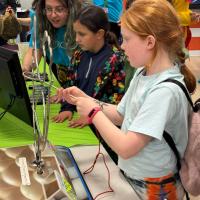 Children playing electric maze