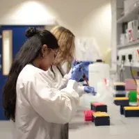 two interns using pippets in the lab