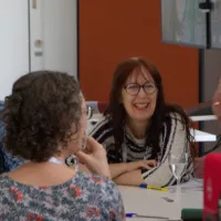 Lively and positive group discussion around a table