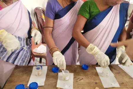 Three women using the UTI diagnostic strip test