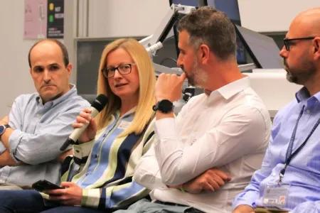 Panel members speaking about translation for impact