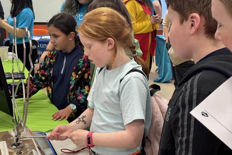 Children playing circuit buzzer game at Doors Open Day event