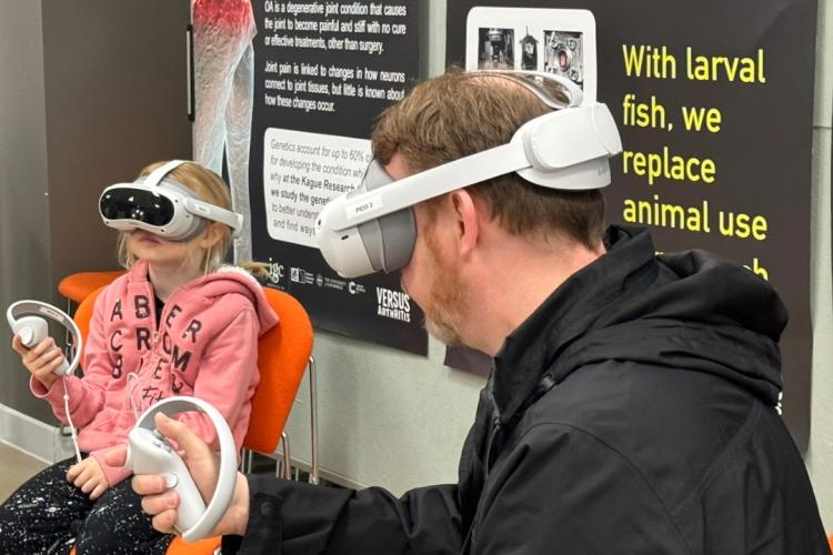 Father and daughter using VR headsets