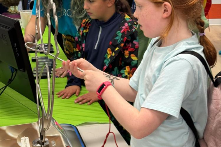 Children playing electric maze