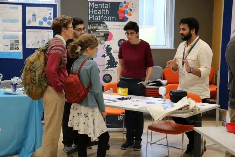 Volunteers explaining their mental health platform to public