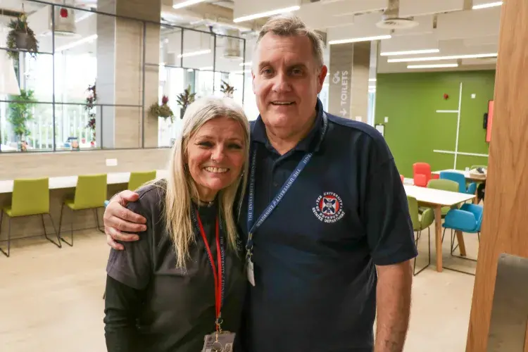 Two volunteers hugging for the camera