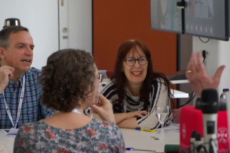 Lively and positive group discussion around a table