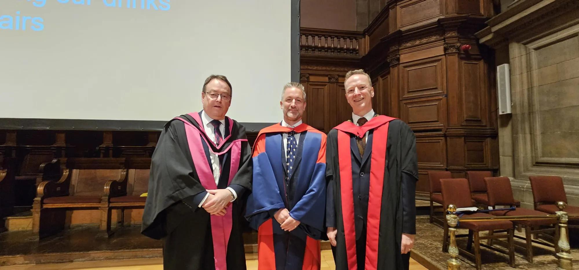 Prof Baillie with David Argyle (left) and Jim Flett-Wilson (right) in their gowns