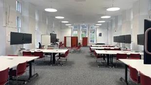 Inside of EFI room with desks, chairs and screens laid out in groups