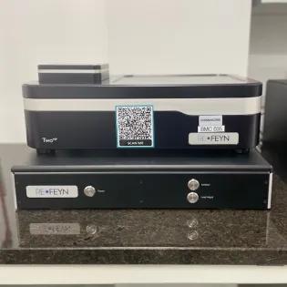 Mass photometer instrument on laboratory bench. Used for measuring molecular mass of biomolecules in solution.