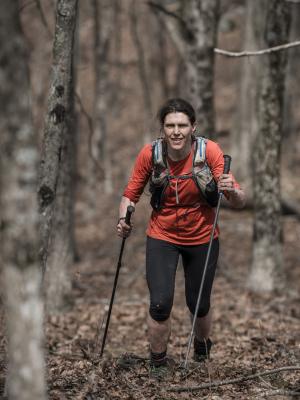 Picture of Jasmin Paris running up a hill