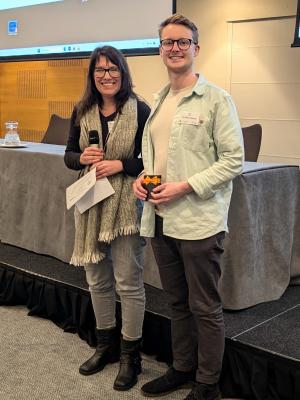 Rose Ruiz-Daniels poses with Oliver Teenan holding award