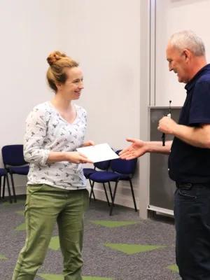 Jenny Riches being presented her poster prize