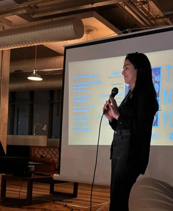 Simran Kapoor presenting in front of a screen