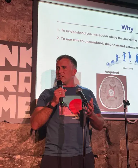 Rob Illingworth presenting in front of a screen